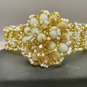 Woven Flower Beaded Bracelet with Shimmery Gold and White Accents. 7 inches
